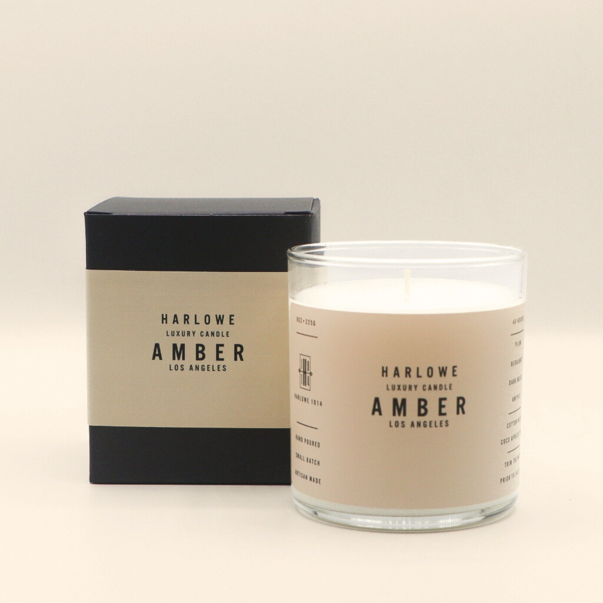 Harlowe Amber candle and packaging on a beige background