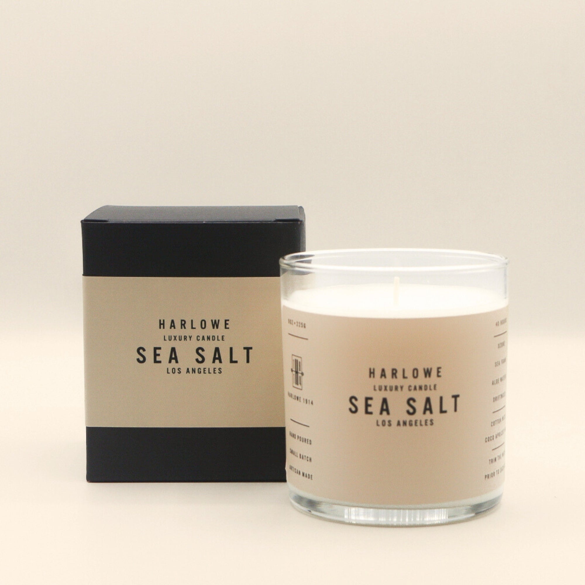 Harlowe Sea Salt candle and packaging on a beige background