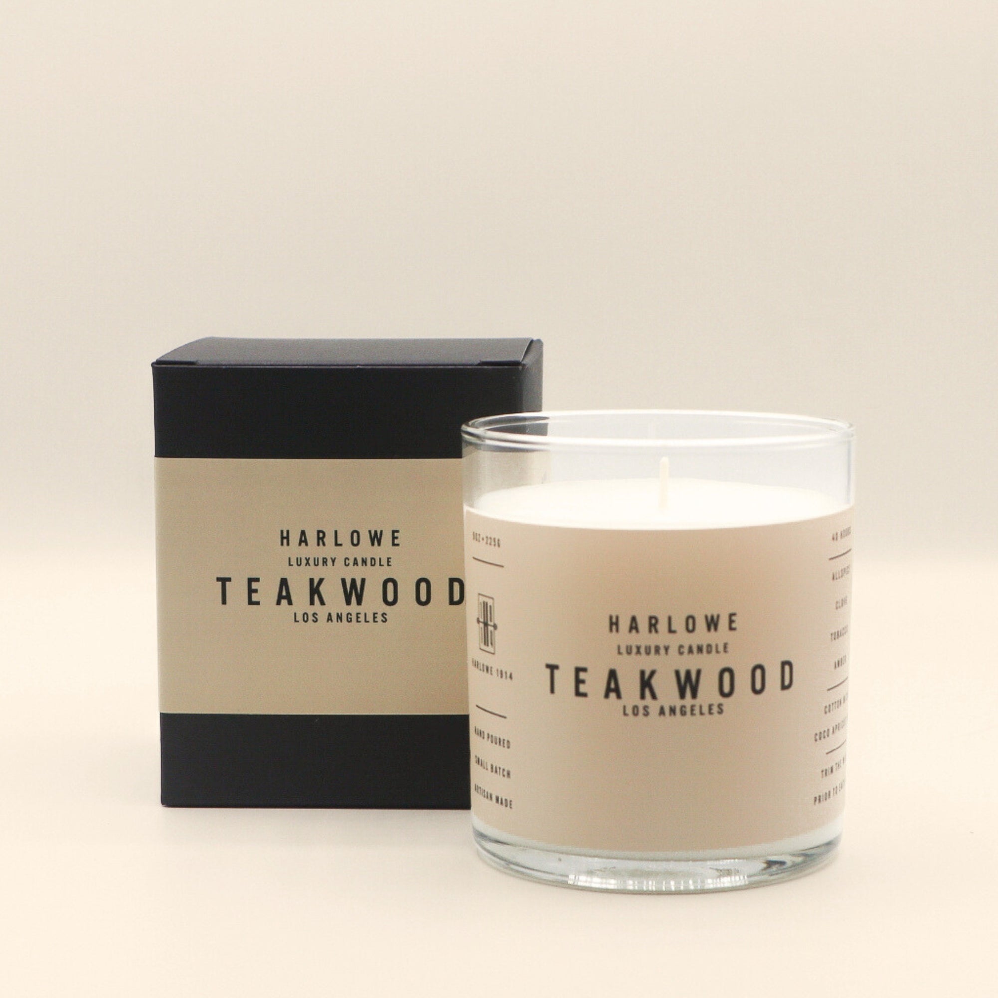 Harlowe Teakwood candle and packaging on a beige background