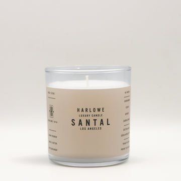 Harlowe Luxury Candle with Santal label on a beige background