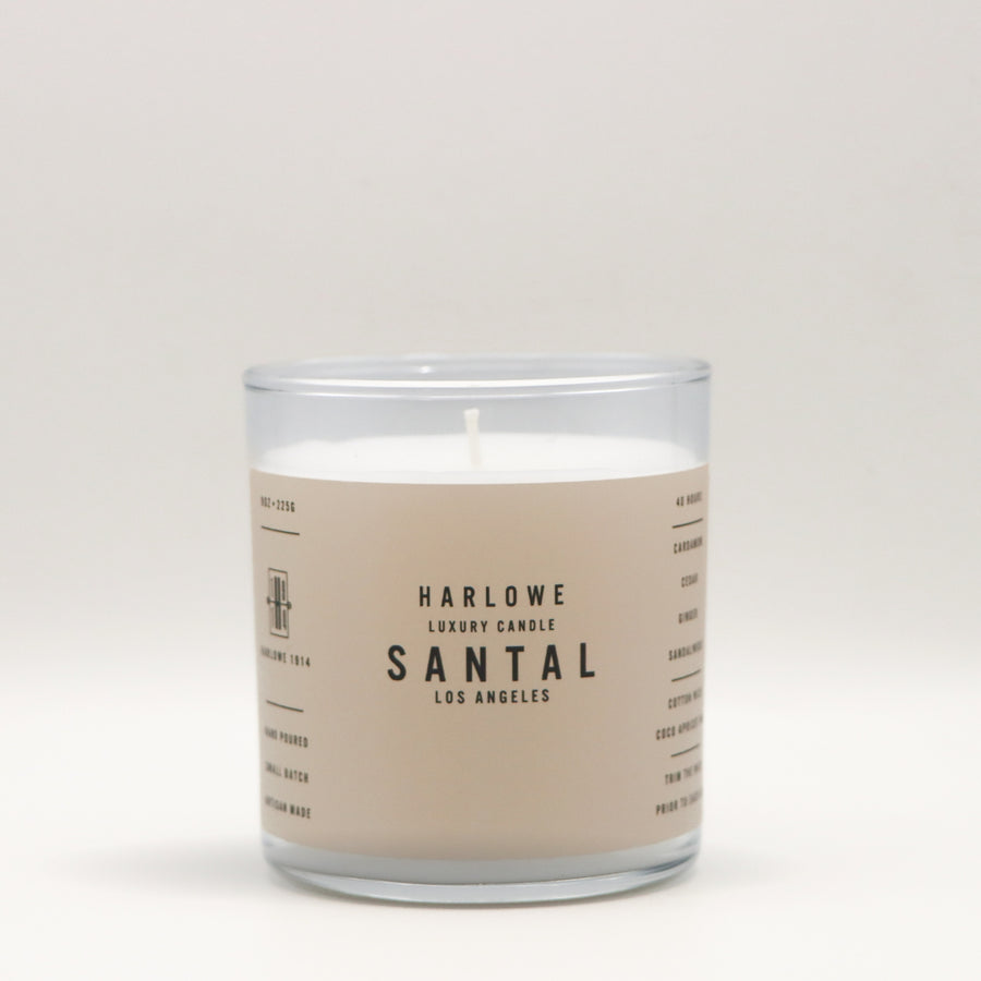 Harlowe Luxury Candle with Santal label on a beige background