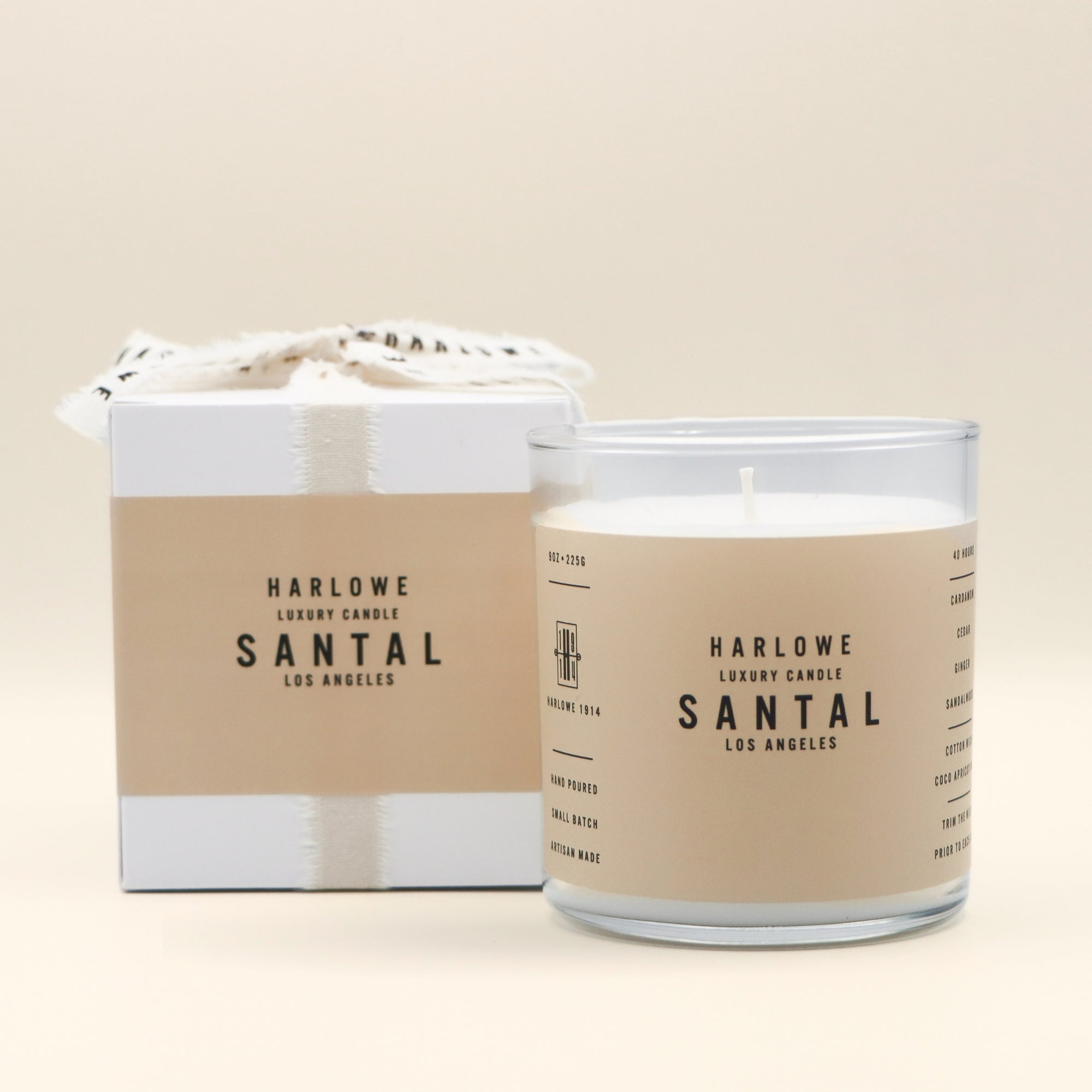 Harlowe Luxury Candle Santal candle with packaging on a beige background