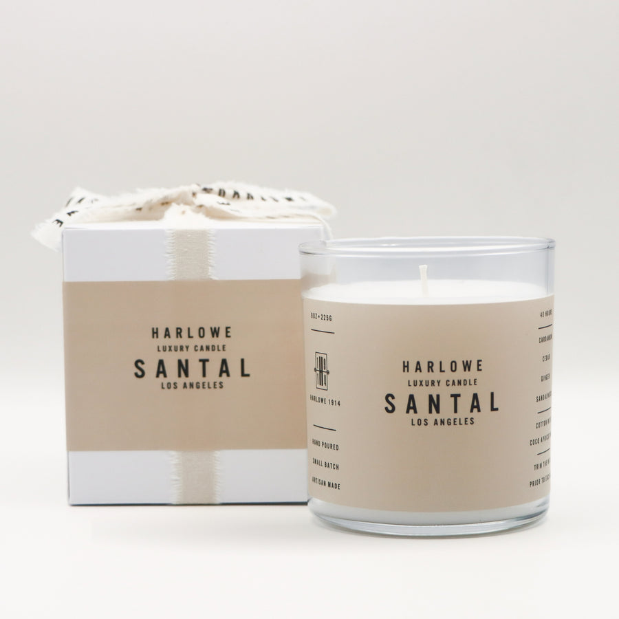 Harlowe Luxury Candle Santal with candle and box on a light gray background