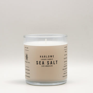 Harlowe Luxury Candle with Sea Salt label on a beige background