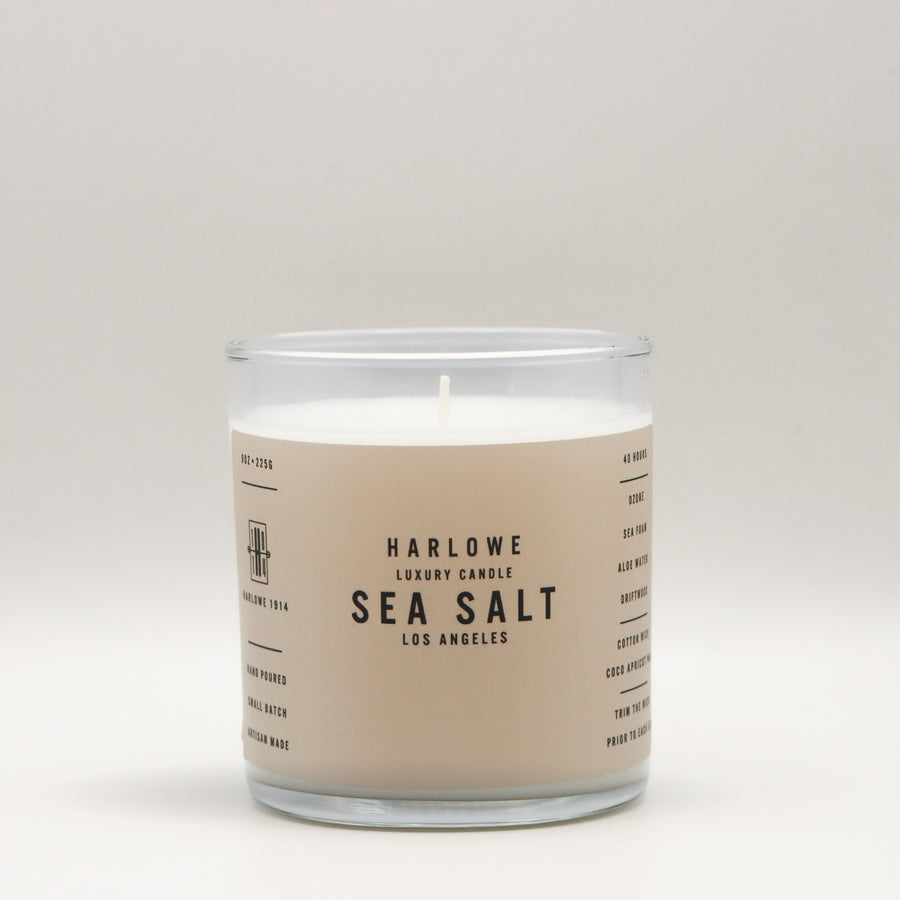 Harlowe Luxury Candle with Sea Salt label on a beige background