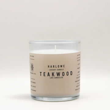 Harlowe Luxury Candle with 'Teakwood' scent on a beige label against a white background